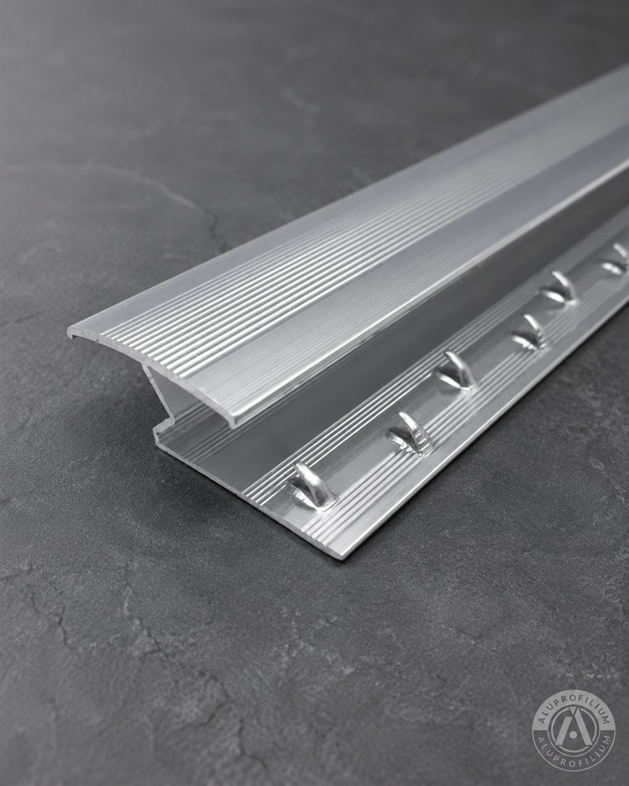Silver aluminum carpet trim profile for carpet and tile floor junctions