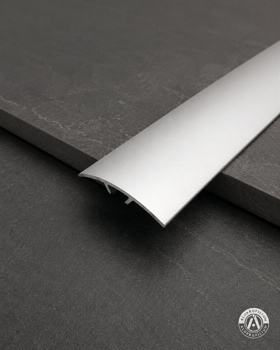 Silver aluminum doorway threshold profile for floor transition